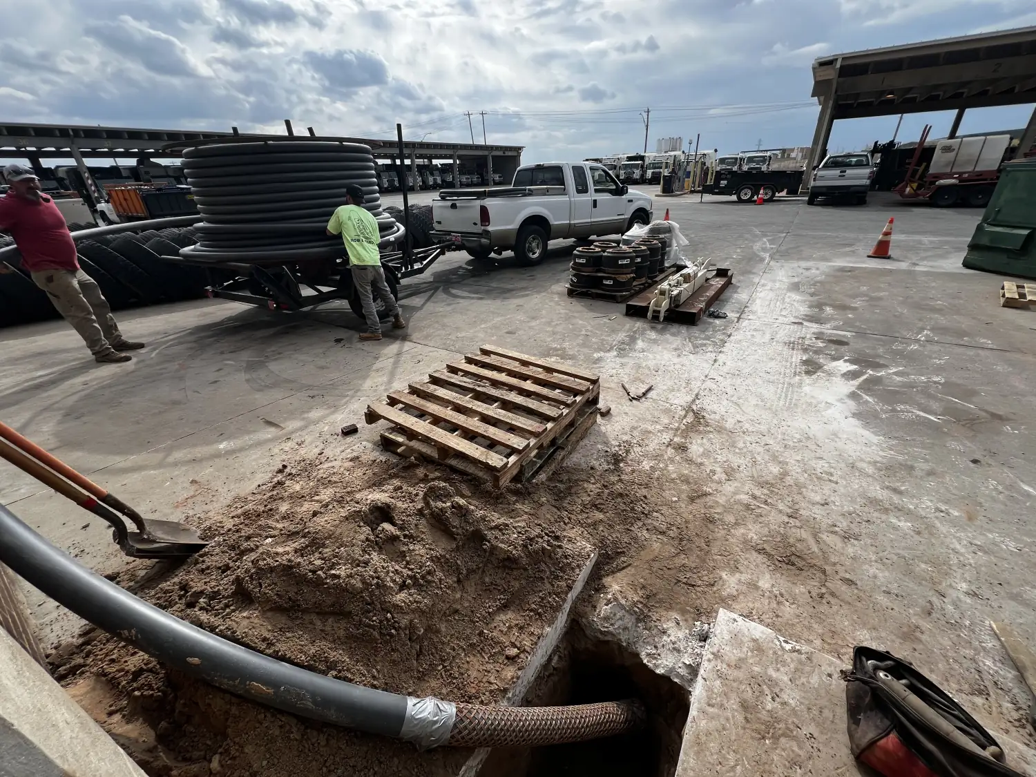 Coiled conduit, bore rods and pallets staged in the Trinity Boring Solutions equipment yard in Oklahoma